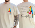 Wrinkles Only Go Where Smiles Have Been T-Shirt – Tropical-Inspired Memorial Tee with Palm Tree Graphic, Double-Sided Unisex Shirt